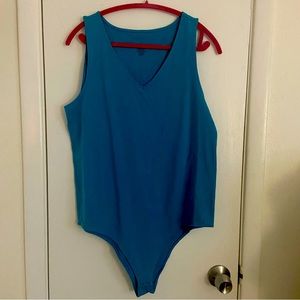 NWT Torrid Size 2 (18/20) Turquoise Bodysuit. Brand New With Tags.